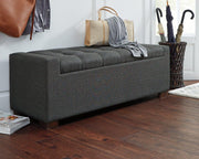 Ashley Furniture Cortwell Storage Bench with cushioned top and wooden legs, ideal for entryways or living room storage.