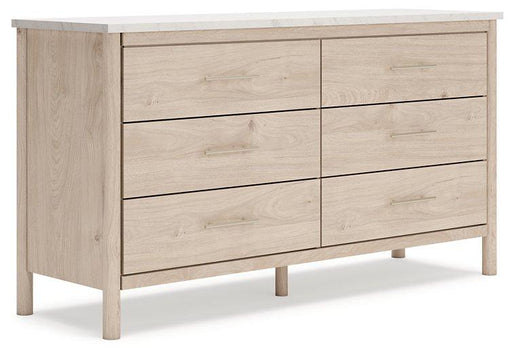 Ashley Furniture Cadmori dresser with multiple drawers and a sleek wood finish, perfect for bedroom storage.