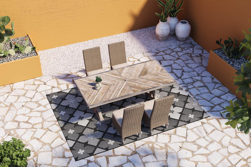 Ashley Furniture Beachcroft outdoor dining set with a table and chairs, ideal for patio or garden dining.