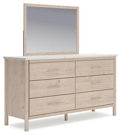 Ashley Furniture Cadmori dresser with matching mirror, showcasing a modern bedroom storage and decor set.