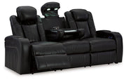Ashley Furniture Caveman Den Power Reclining Sofa with plush cushions and reclining features, perfect for modern living rooms.