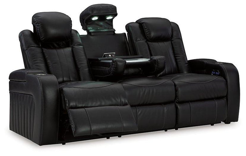 Ashley Furniture Caveman Den Power Reclining Sofa with plush cushions and reclining features, perfect for modern living rooms.