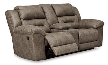 Ashley Furniture Stoneland reclining loveseat with built-in console, plush fabric upholstery, and padded armrests.