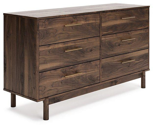 Ashley Furniture Calverson Dresser with wood finish and multiple drawers, showcasing its sleek design and modern storage solution.