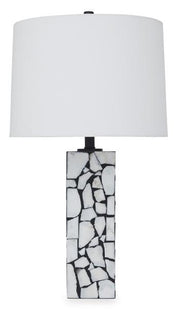 Macaria table lamp by Ashley Furniture with a sleek base and fabric shade, perfect for modern home lighting.