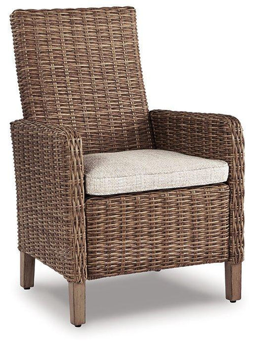 Set of two Ashley Furniture Beachcroft outdoor arm chairs with cushions, ideal for patio or garden seating.