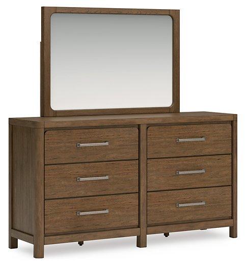 Cabalynn dresser and mirror by Ashley Furniture featuring a wooden dresser with a matching framed mirror in a modern bedroom setting
