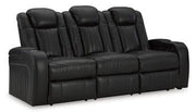 Ashley Furniture Caveman Den Power Reclining Sofa with plush cushions and reclining features in a modern living room setting.