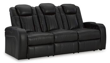 Ashley Furniture Caveman Den Power Reclining Sofa with plush cushions and reclining features in a modern living room setting.