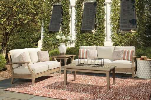 Clare View outdoor seating set by Ashley Furniture with cushioned chairs and a table, perfect for patio relaxation.