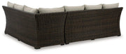 Outdoor sectional sofa set with cushions by Ashley Furniture, includes three sectional pieces for patio or garden lounging.