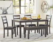 Ashley Furniture dining table set with matching chairs and bench, showcasing a modern wooden dining room arrangement.