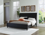 Ashley Furniture Danziar Bed with a wooden frame and elegant headboard, shown in a cozy bedroom setting.
