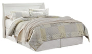 Ashley Furniture Anarasia Bed with upholstered headboard and wooden frame, shown in a modern bedroom setting.