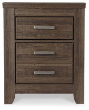 Ashley Furniture Juararo nightstand with a dark wood finish, featuring a sleek design and storage drawer.