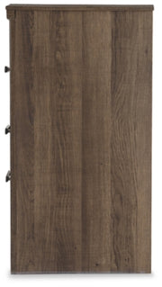 Ashley Furniture Juararo nightstand with a modern design, featuring a dark wood finish and sleek hardware on a bedroom side table.