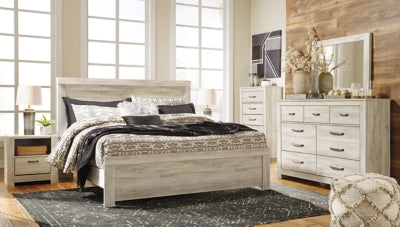 Ashley Furniture Bellaby Bed with a sturdy wooden frame and classic design, shown in a neutral finish.