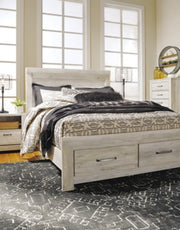 Ashley Furniture Bellaby Bed with a modern design, showcasing a sturdy wooden frame and a stylish headboard in a natural finish.