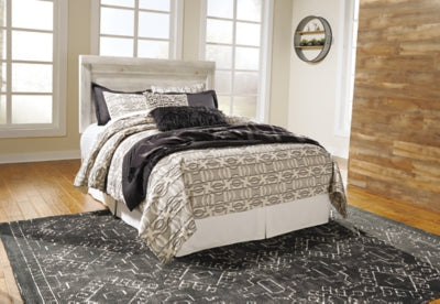Ashley Furniture Bellaby Bed in a classic design with a wooden frame and panel headboard for a cozy bedroom setting.