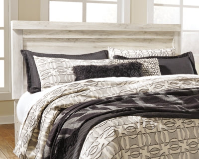 Ashley Furniture Bellaby Bed in a cozy bedroom setting, showcasing the stylish frame and headboard design.