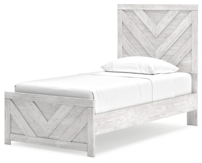 Ashley Furniture Cayboni Bed with a modern upholstered headboard and sturdy wooden frame, shown from an angled view.