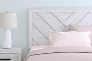 Ashley Furniture Cayboni Bed with detailed close-up of the headboard and rich wood finish.