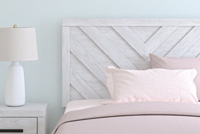 Ashley Furniture Cayboni Bed with detailed close-up of the headboard and rich wood finish.