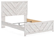 Ashley Furniture Cayboni Bed in warm wood finish, view showing headboard and side profile.
