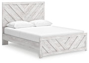 Ashley Furniture Cayboni Bed with dark wood finish, shown from a side angle, featuring a modern design with clean lines.