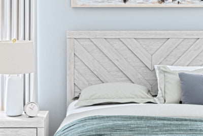 Ashley Furniture Cayboni Bed with detailed headboard featuring a modern, elegant design in rich wood finish.