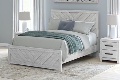 Ashley Furniture Cayboni Bed showcasing a modern bedroom design with a sturdy wooden frame and stylish headboard.
