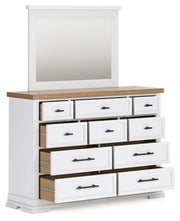 Ashley Furniture Ashbryn bedroom set with open view of bed frame and matching furniture pieces in a stylish bedroom display.
