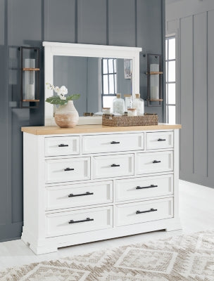 Ashbryn bedroom set by Ashley Furniture featuring a bed frame, dresser, and nightstands in a modern bedroom design.