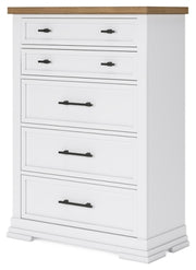 Angle view of Ashley Furniture Ashbryn Chest of Drawers, a stylish wooden storage chest with multiple drawers.