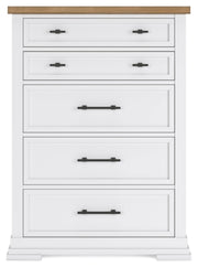 Ashbryn chest of drawers by Ashley Furniture featuring a modern wooden finish and sleek drawer handles.