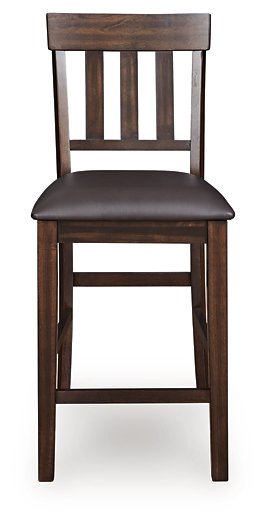 Ashley Furniture Haddigan counter height bar stool with wooden legs and upholstered seat, shown from a front head-on view.