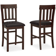 Ashley Furniture Haddigan counter height bar stool with wooden legs and cushioned seat in green fabric.