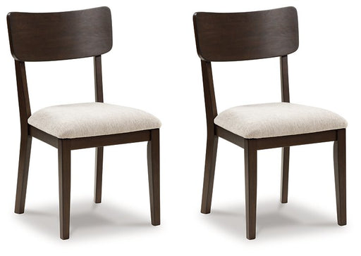 Ashley Furniture Mallenette dining chair with upholstered seat and back, shown from a side angle in a modern dining room setting.