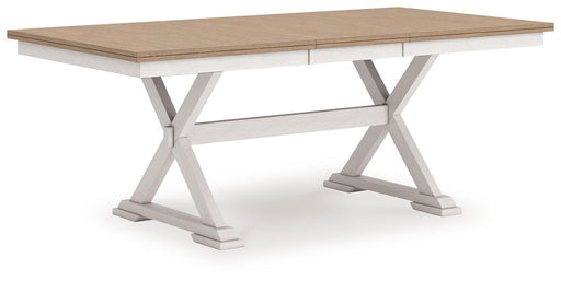 Ashley Furniture Purlaney Dining Butterfly Extension Table shown from an angled view, showcasing the wooden surface and extendable design.