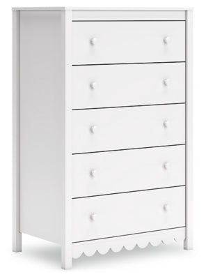 Ashley Furniture Hallityn chest of drawers with a sleek wooden finish, shown from an angled side view.
