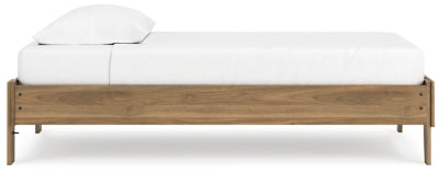 Ashley Furniture Deanlow Bed with a wooden frame and side panels, showcasing a modern bedroom design.
