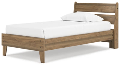 Ashley Furniture Deanlow Bed with a modern wood finish, shown from an angled view highlighting the headboard and frame.