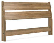 Ashley Furniture Deanlow Bed with a modern wooden frame and angled headboard, shown from a side angle.