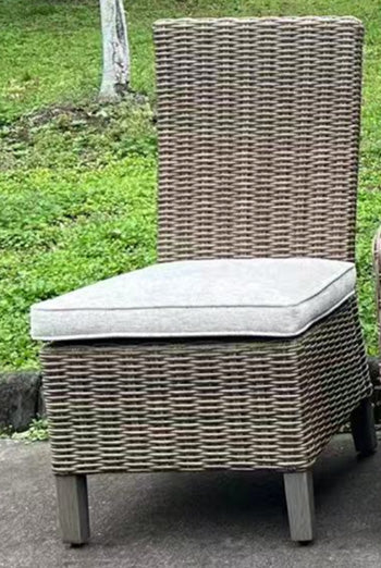 Set of two Ashley Furniture Laguna Heights outdoor dining side chairs with cushions, featuring metal frames and woven seats.