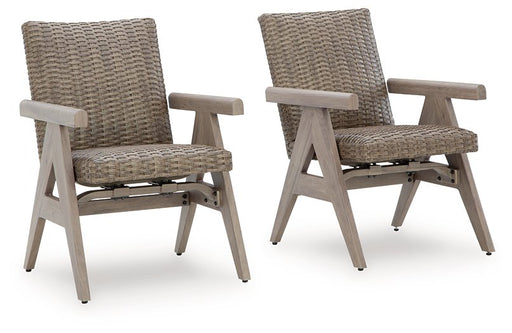 Pair of Ashley Furniture Cliff Trails outdoor rocking arm chairs, stylish outdoor dining chairs with wooden frames and woven seats.