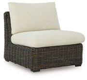 Ashley Furniture Kimora outdoor sectional with plush cushions and wicker frame, ideal for patio or garden seating.