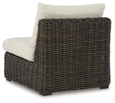 Ashley Furniture Kimora outdoor sectional with cushioned seating and a sturdy frame, designed for stylish outdoor relaxation.