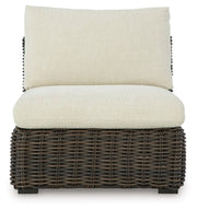 Kimora outdoor sectional by Ashley Furniture, featuring stylish outdoor seating with plush cushions and modern design.