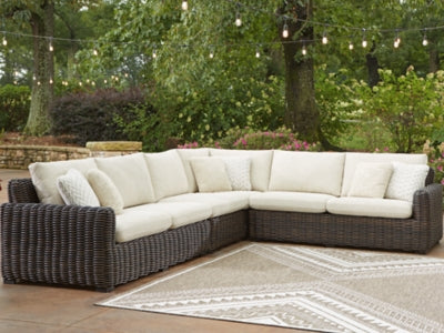 Ashley Furniture Kimora outdoor sectional with plush cushions and modern design, perfect for outdoor seating and entertaining.