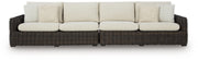 Ashley Furniture Kimora outdoor sectional with beige cushions and dark wicker frame, designed for stylish outdoor seating.